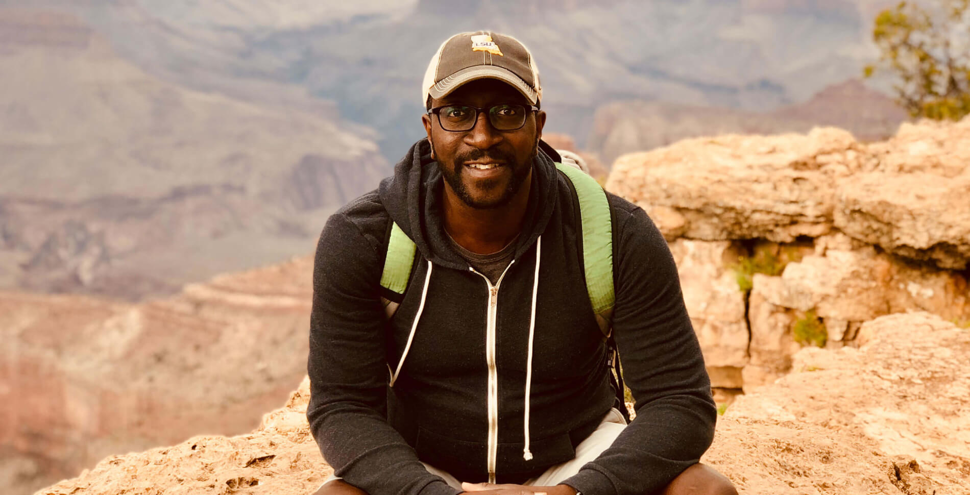 Vince Tardy, sitting on the North Rim of the Grand Canyon